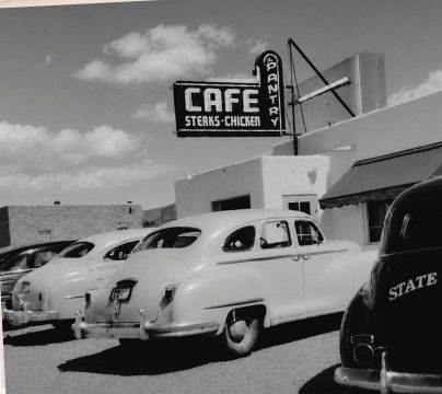 The Pantry around 1949: a CAFE, STEAKS AND CHICKEN sign with PANTRY running down its side, above a row of late-1940s cars.